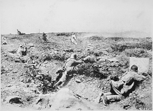 Entrenched German troops fighting off a French attack German trench WW1 French attack.gif