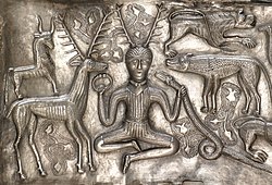 Image of an antlered figure on the Gundestrup cauldron, interpreted by many archaeologists as being cognate to the god Cernunnos. Gundestrupkedlen- 00054 (cropped).jpg