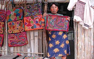 A Kuna woman displays a selection of molas for...