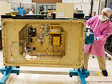 Technicians at NASA Glenn Research Center at work on the Space Communications and Navigation Testbed, formerly known as the Communications, Navigation, and Networking reConfigurable Testbed (CoNNeCT) project NASA's Space Communications Testbed.jpg
