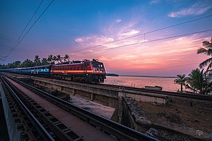 An express train hauled by WAP-4 crossing Peruman Bridge where the crash took place Peruman bridge.jpg