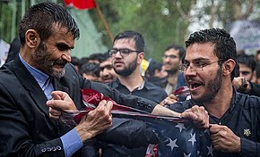 Two protesters in Iran tearing an American flag at an anti-American rally after the American withdrawal from the Iran nuclear deal Protests after US decision to withdraw from JCPOA, around former US embassy, Tehran - 8 May 2018 26.jpg