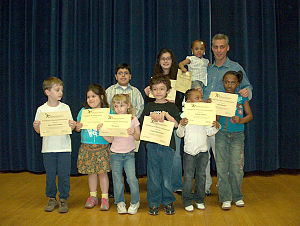 Congressman Rahm Emanuel presents certificates...