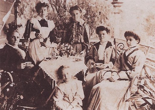 StateLibQld 1 252713 Taking tea on the verandah, ca. 1910.jpg