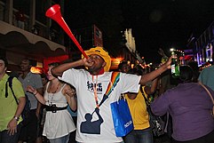 A man sounding a vuvuzela Vuvuzela blower, Final Draw, FIFA 2010 World Cup.jpg