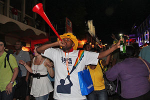 Man blowing a vuvuzela, Cape Town, South Africa