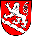 Gemeinde Haag a.d.Amper In Rot ein gesenkter silberner Wellenschrägbalken, darüber ein steigender, herschauender silberner Löwe.