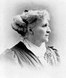 A photograph of Ada Howard, looking right, in black and white