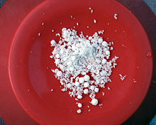 Sample of white powder and spherules