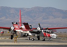 Air Attack 460 at Fox Field during the October 2007 California wildfires with a Lockheed P2V in background Cdf-ov10-N415DF-071022-fox-02-16.jpg