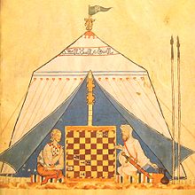 A Christian and a Muslim playing chess, illustration from the Book of Games of Alfonso X (c. 1285). ChristianAndMuslimPlayingChess.JPG