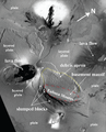 Mass wasting and layered plain on Io. The shape of Euboea Montes, especially the northern flank's thick, ridged deposit, is interpreted by Schenk and Bulmer as evidence of slope failure along the entire face of the northern flank.[3] The northern portion of the image shows layered crust labeled "layered plain".