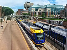 Two Metro Green Line trains on the University of Minnesota-Twin Cities campus Green Line trains on both tracks.jpg