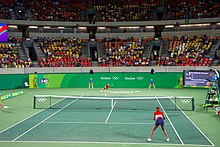 Secretary Kerry Watches As Venus Williams Prepares to Receive a Serve During A Tennis Match (28736162851).jpg