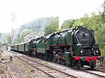 Restored steam locomotives double-heading on an excursion train in Belgium in 2010