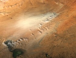 Dust storm in the Bodélé Depression. This particular storm was blowing on the afternoon of 18 November 2004, when the Moderate Resolution Imaging Spectroradiometer (MODIS) flew over on NASA's Aqua satellite. The full-sized image has a resolution of 250 meters per pixel.