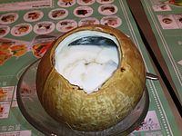 Coconut pudding served in a coconut.