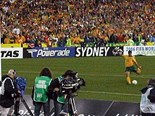 A play-off against Uruguay held at Stadium Australia concluded with a penalty shootout that saw John Aloisi kick the goal (pictured) that sent Australia to the 2006 FIFA World Cup. Aloisi penalty - The Moment.JPG