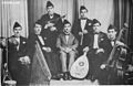 Image 17Iraqi music group led by Yusuf Za'arur in Baghdad, wearing the sidara, ca 1930. (from Music of Iraq)
