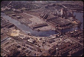 Color image of a heavy industrial district abutting a winding river
