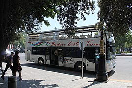 White, double-deck tour bus