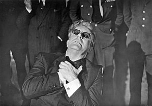 English: Dr. Strangelove trying to resist his ...