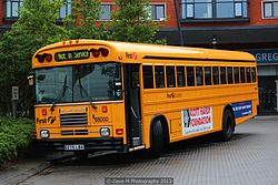 A right-hand drive American-sourced school bus (Blue Bird TC/2000) operated by First Student UK.