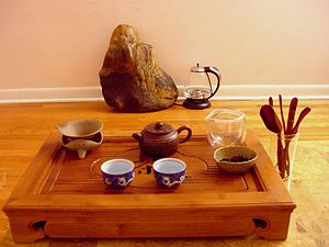 A gongfu tea table with accessories.