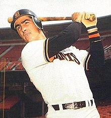 Jack Clark of the San Francisco Giants is photographed in 1983. That year, the MLB made it mandatory for batters to wear at least one ear protector on their batting helmet, like the one Clark is wearing. Jack Clark 1983 (cropped).jpg