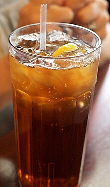 A glass of tea with lemon