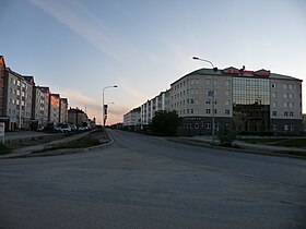 Top left: Nenets Autonomous Federal Hall; top right; Zapolyarnaya Stolitsa Avenue; second from the top: Naryan-Mar post office; second from the bottom: Town Administration building; bottom left: a church in Naryan-Mar; bottom right: culture center