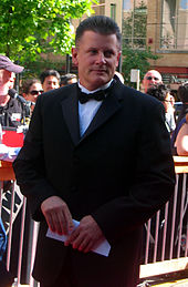 Marc Crawford became the Canucks' head coach in 1998-99. Crawford also played for the team in the 1980s. Marccrawford 2006nhlawards.jpg