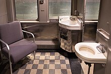'Whites Only' - Men's restroom and smoking lounge in Southern Railway Company Coach No. 1200, 1923, redesigned as a segregated car in 1940 Men's restroom and smoking lounge in a Southern Railway Company car at the National Museum of African American History and Culture.jpg