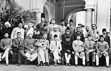 The leaders of the Muslim League, 1940. Jinnah is seated at centre. Muslim League leaders after a dinner party, 1940 (Photo 429-6).jpg