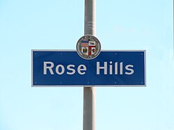 Rose Hills neighborhood sign located at the intersection of Huntington Drive and Collis Avenue
