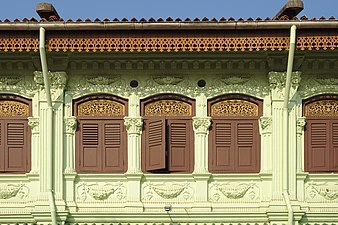 Ornamentation of a shophouse around Arab Street, Singapore. Elaborate ornamentation is typically a mark of wealth for the owner who commissioned the construction of the building.