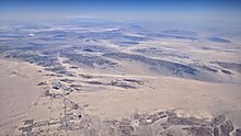 Aerial view of Twentynine Palms from the south, with Mojave Desert behind Twentynine Palms aerial.jpg