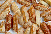 Unpolished long-grain rice grains with bran.