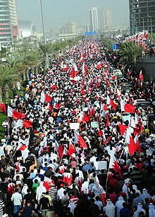 Protesters in the middle of the road in downtown Manama, Bahrain (2011) 4bahrain22011.jpg