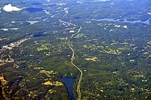 Byram Lake Reservoir (center bottom) with Seven Springs (large deforested area) on left side of lake Aerial - Muscoot Reservoir & Cross River Reservoir, NY 01 - white balanced (9614400358).jpg