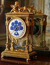 Astronomical clock; by Philippe-Jacques Corniquet; c.1794; gilt bronze and enamel face; unknown dimensions; Musée des Arts Décoratifs, Paris[71]