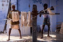 Cotton being dyed manually in contemporary India Cotton dyeing in India.jpg