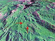 Oblique false-colour Landsat image of Darwin Crater (arrowed) draped over digital elevation model; screen capture from NASA World Wind