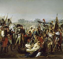 Peinture à l'huile montrant Napoléon au premier plan observant le corps de Desaix. Desaix est vêtu d'une chemise blanche et son torse est mis à nu afin de montrer la blessure. Un grand nombre de curieux assistent également à la scène.