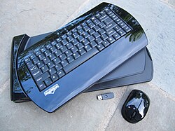 Black wireless keyboard with thumb drive and wireless mouse