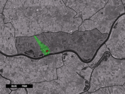 The town centre (red) and the statistical district (light green) of Tuil in the municipality of Neerijnen.