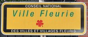 La récompense "Ville Fleurie", également connue sous le nom de "Villes et Villages fleuris[17]