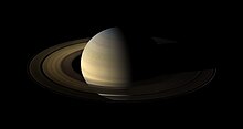 Cassini mosaic of Saturn's rings on August 12, 2009, a day after equinox. With the rings pointed at the Sun, illumination is by light reflected off Saturn, except on thicker or out-of-plane sections, like the F Ring. Saturn, its rings, and a few of its moons.jpg