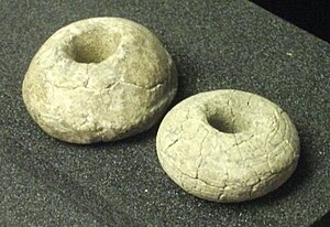 Saxo-Norman clay spindle whorls, on display in the Higgins Art Gallery & Museum SpindlewhorlsBedfordMuseum.JPG