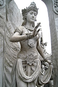 The image of a woman or a goddess in ancient regal attire at Indonesian National Monument, Jakarta. It is probably the popular depiction of Ibu Pertiwi in Indonesia. Statue of Goddess or Queen at Monas.JPG